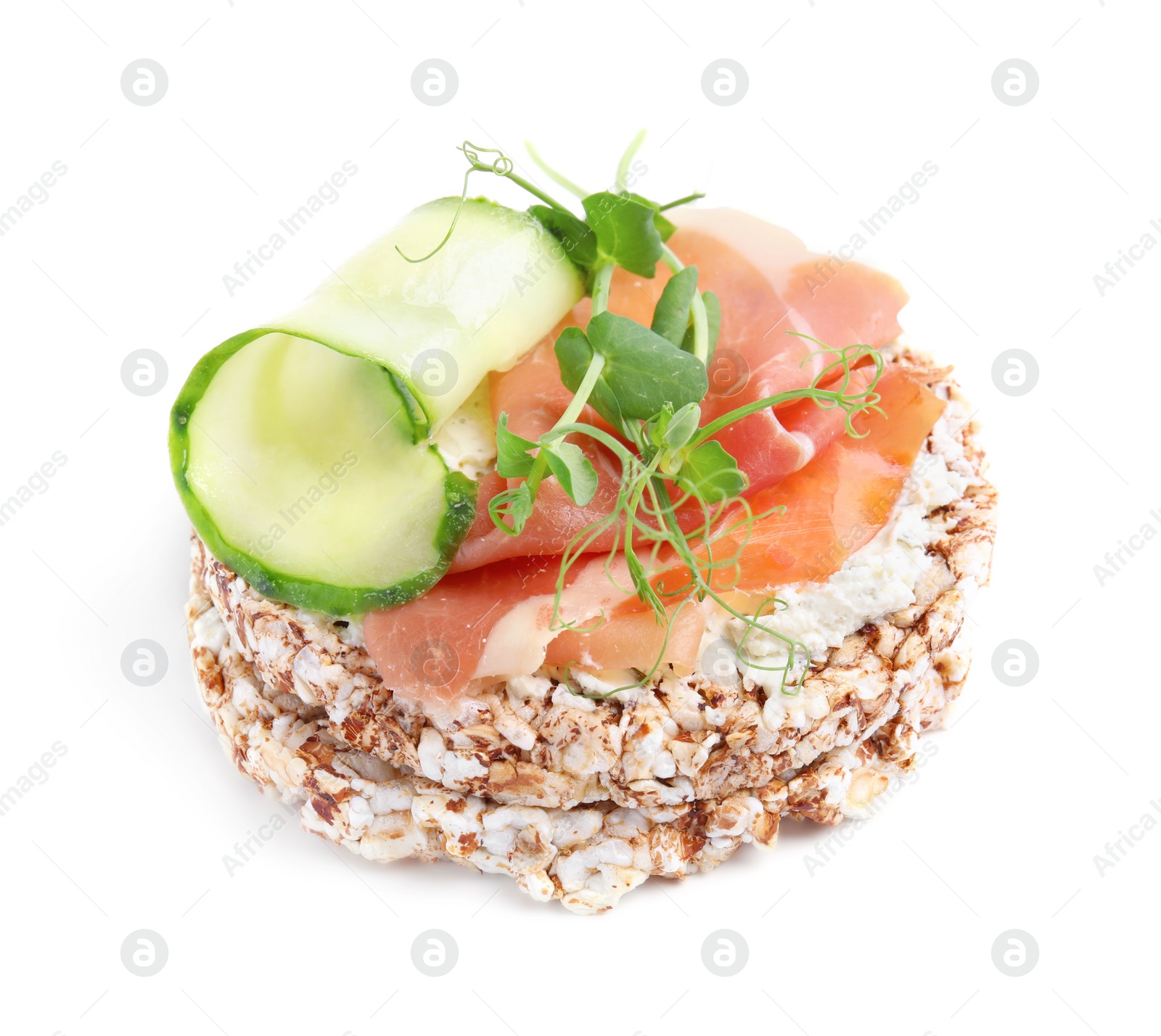Photo of Crunchy buckwheat cakes with cream cheese, prosciutto and cucumber slice isolated on white