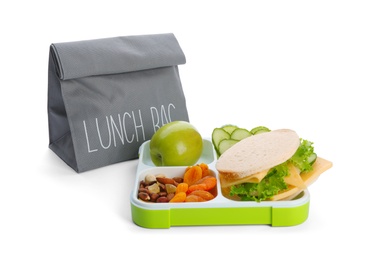 Photo of Lunch box with appetizing food and bag on white background