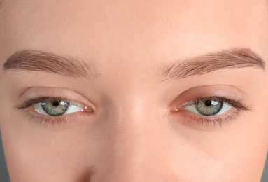 Young woman with beautiful natural eyelashes, closeup