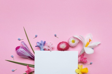 Photo of Flat lay composition with spring hyacinth flowers and blank card on color background, space for text