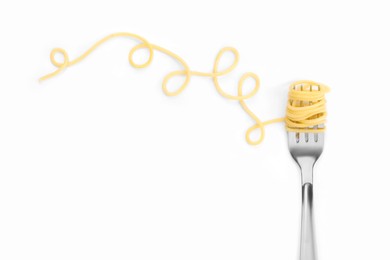 Fork with tasty pasta on white background, top view. Space for text