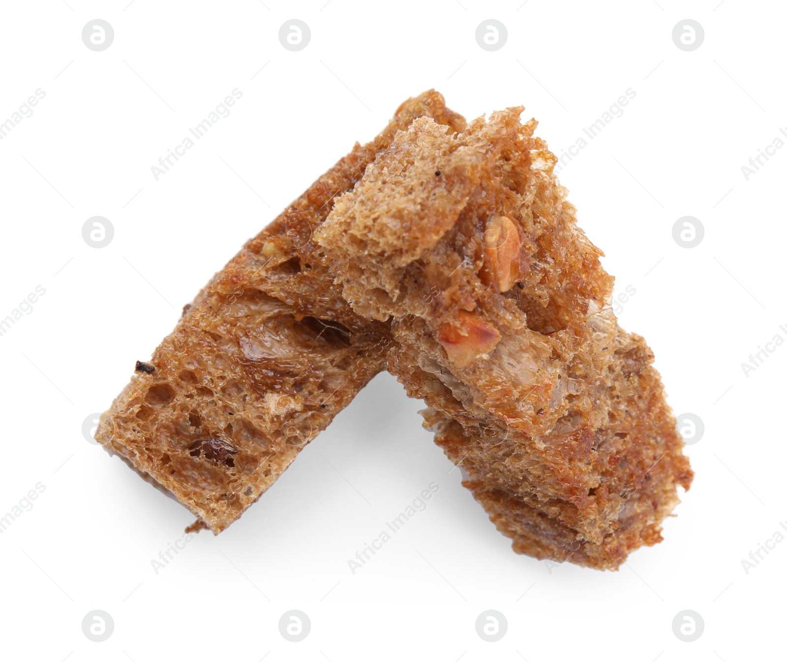Photo of Crispy rusks isolated on white, top view