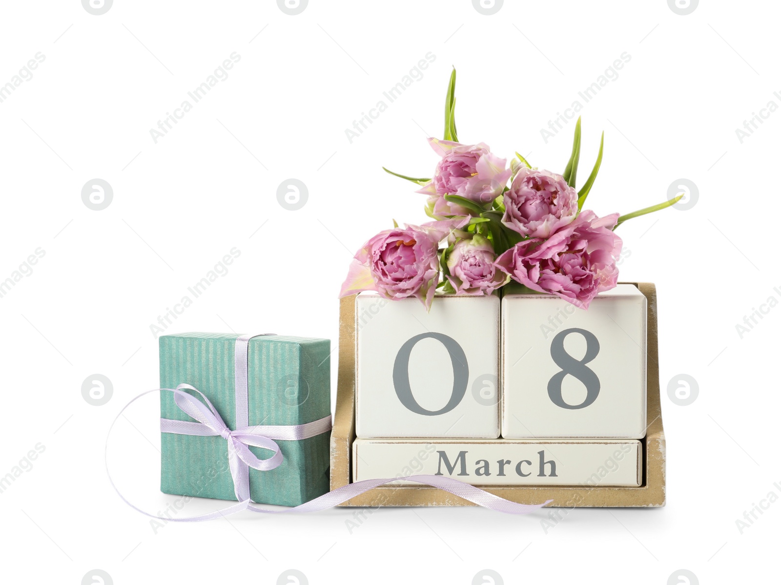 Photo of Wooden block calendar with date 8th of March, gift and tulips on white background. International Women's Day