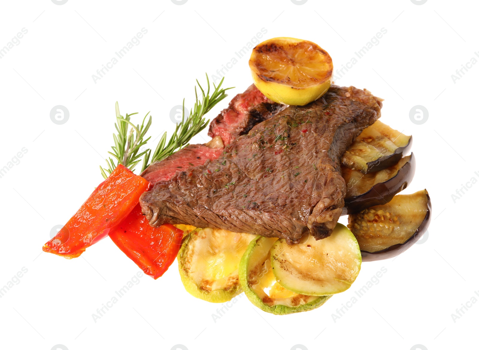 Photo of Delicious grilled beef steak with vegetables, spices and lemon isolated on white