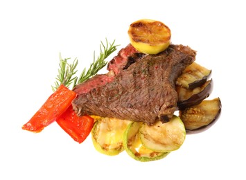 Delicious grilled beef steak with vegetables, spices and lemon isolated on white