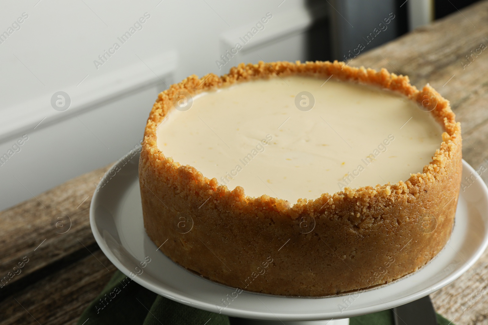 Photo of Tasty vegan tofu cheesecake on wooden table