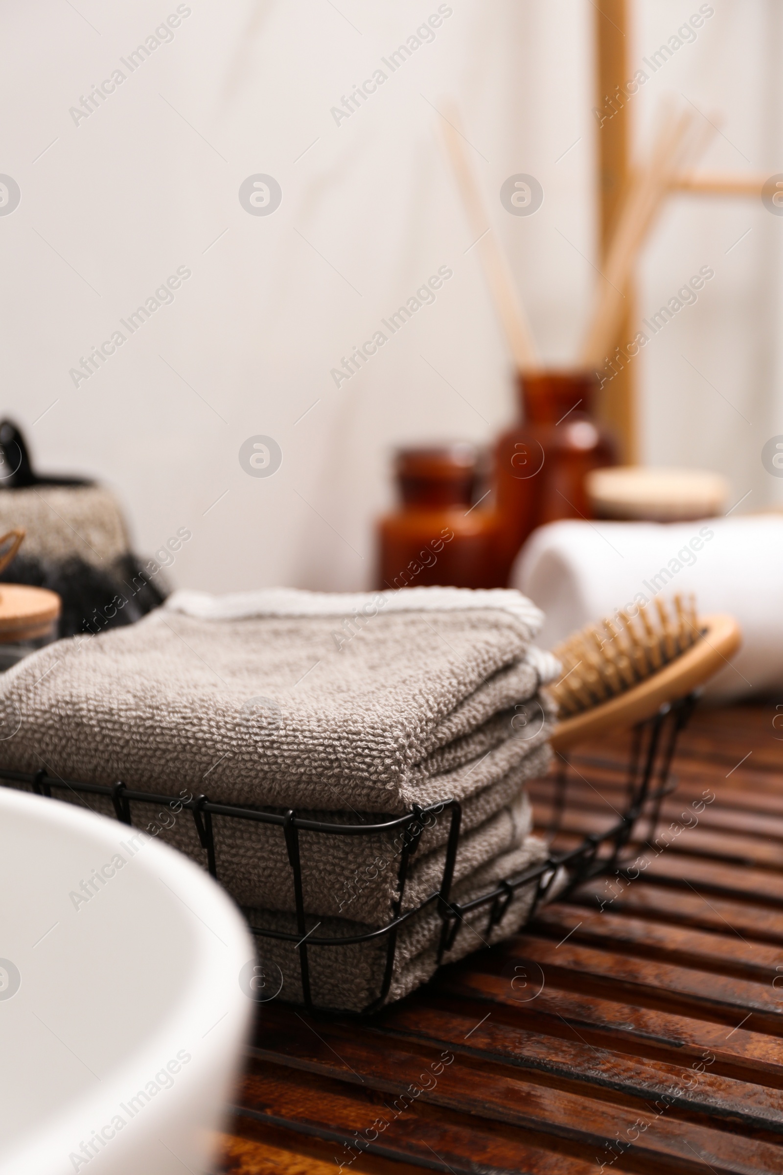 Photo of Personal hygiene products on wooden table in bathroom