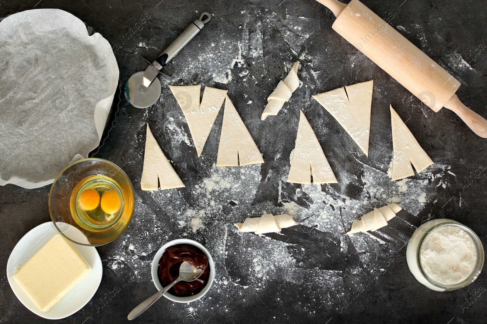 Photo of Flat lay composition with ingredients for tasty croissants on grey background