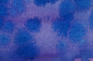 Photo of Abstract watercolor painting with blue blots as background, top view