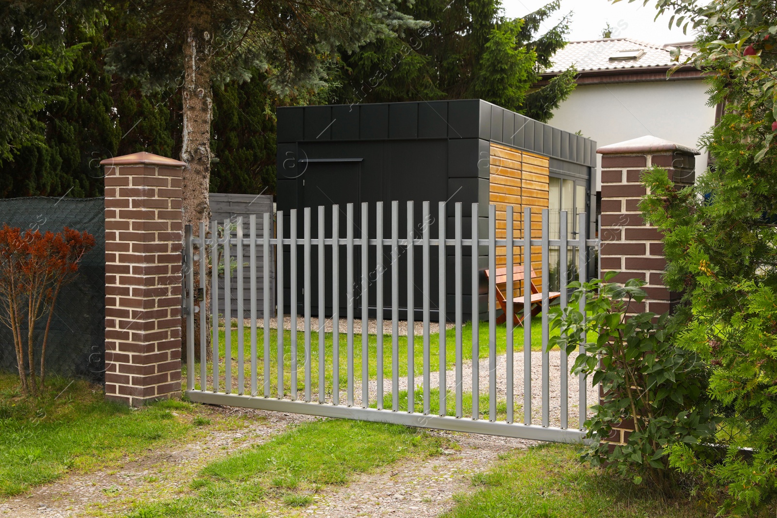 Photo of Grey metal gates near private house on street