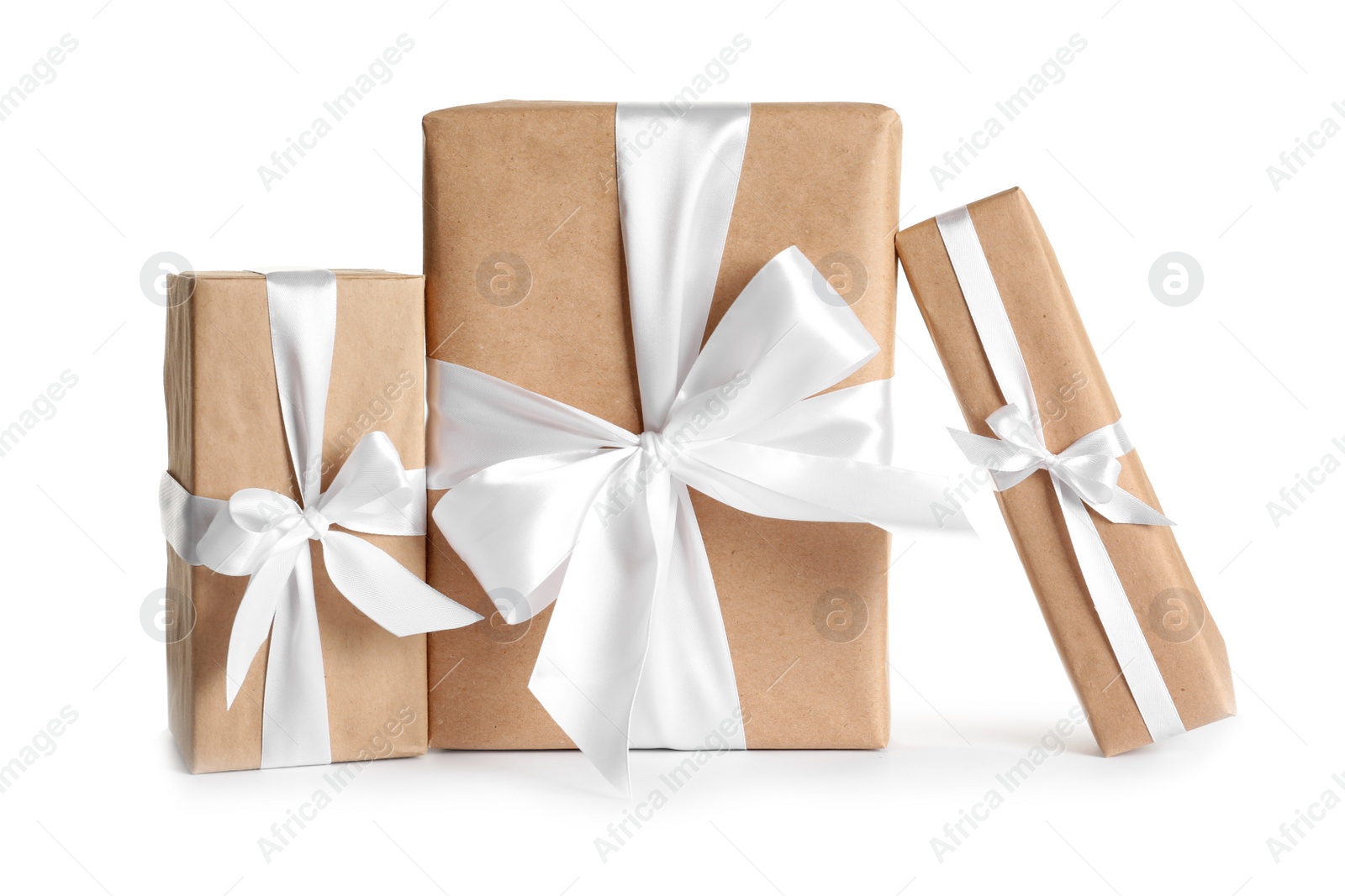 Photo of Beautifully wrapped gift boxes on white background