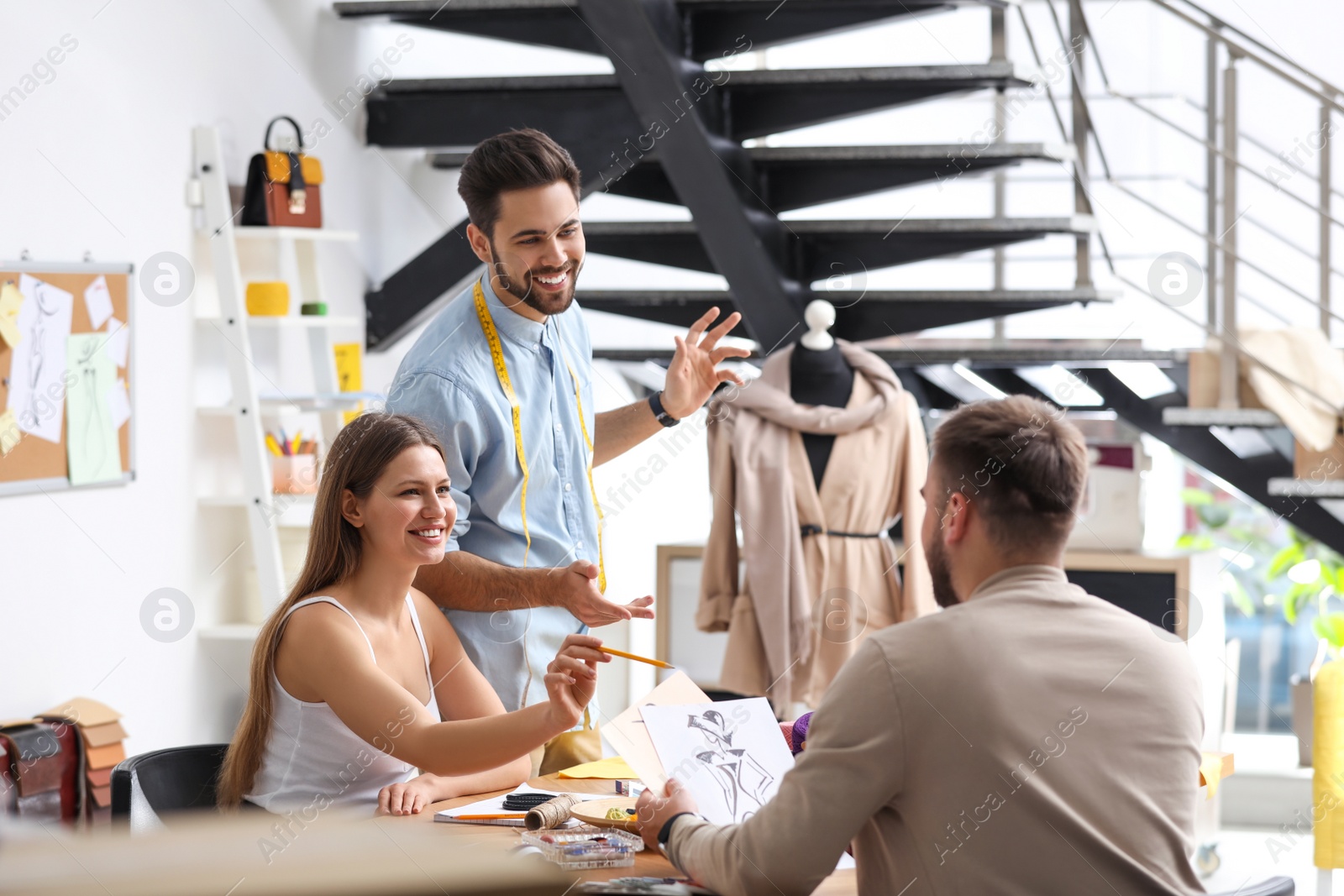 Photo of Fashion designers creating new clothes in studio