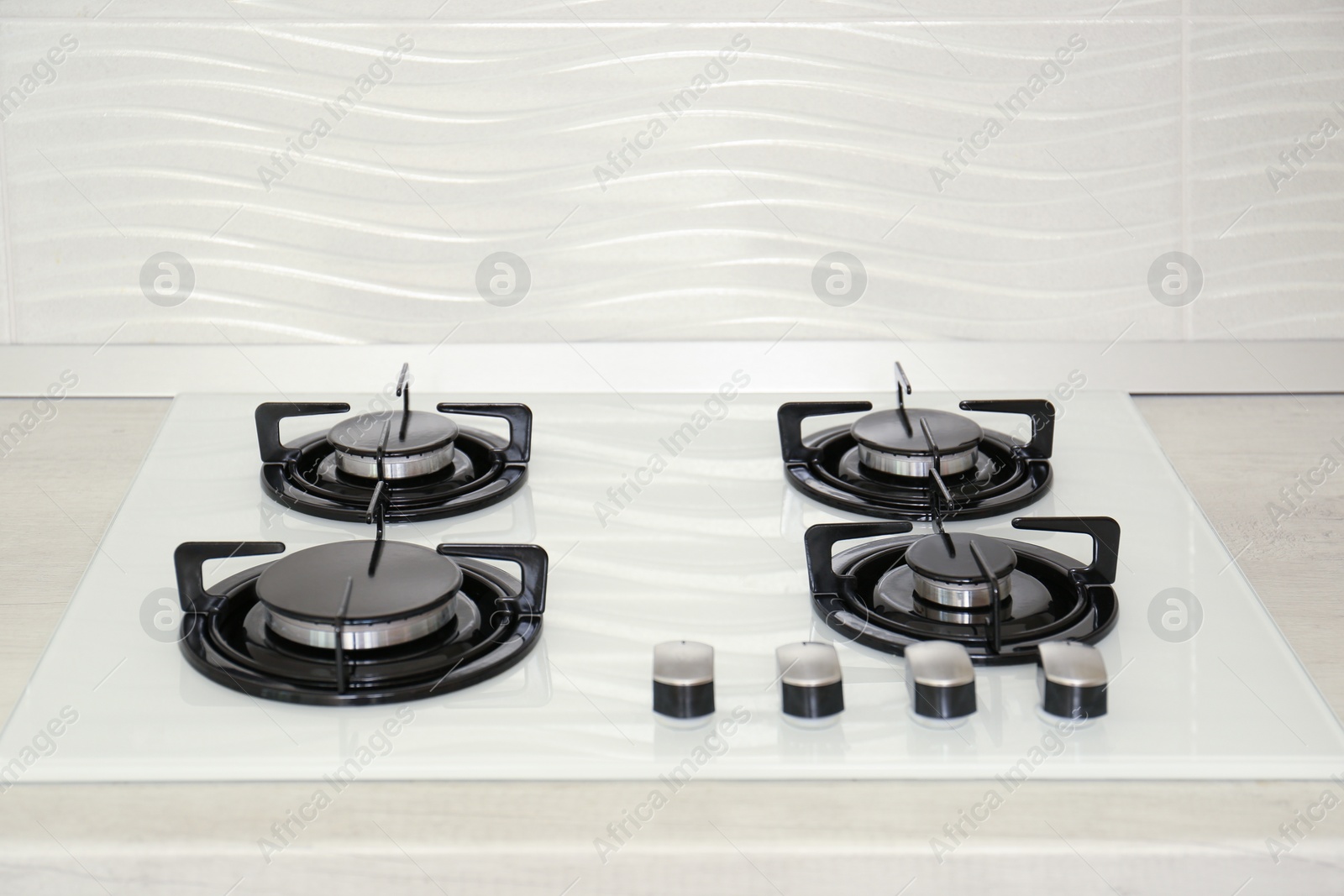 Photo of Modern gas hob in kitchen. Domestic appliance