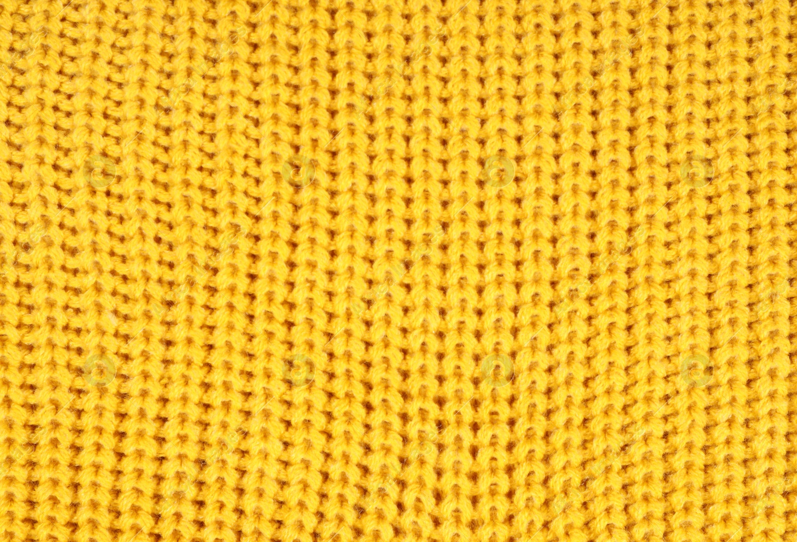 Photo of Texture of cozy warm sweater as background, closeup