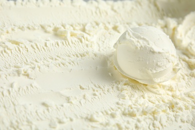 Photo of Ball of delicious vanilla ice cream, closeup. Space for text