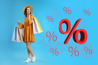Image of Discount offer. Beautiful woman with shopping bags on light blue background. Percent signs near her