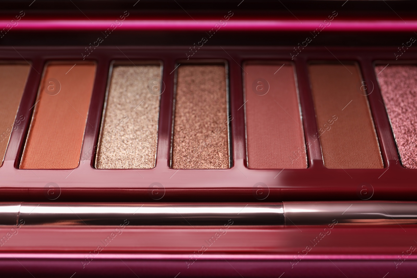 Photo of Beautiful eye shadow palette and brush, closeup view