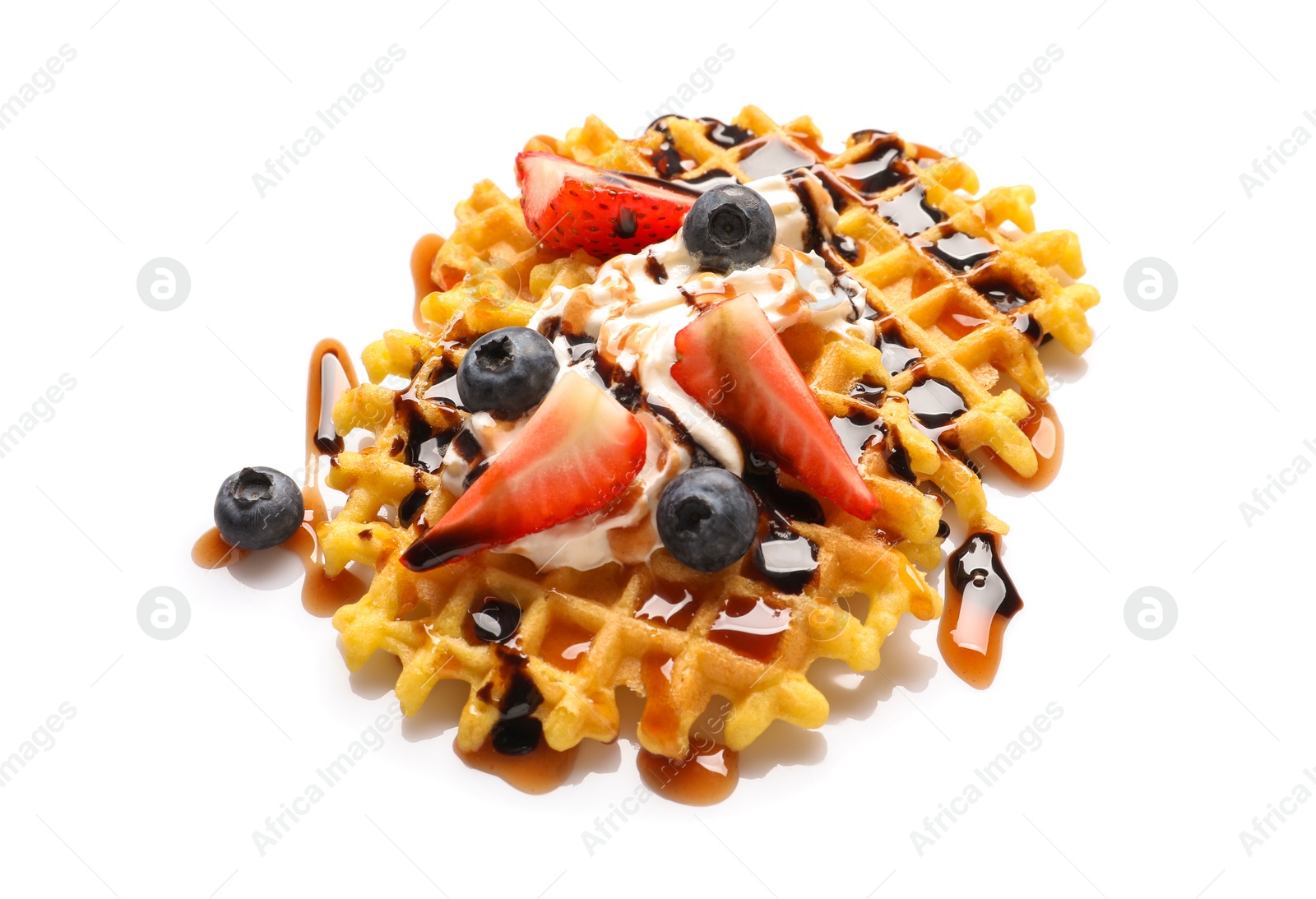 Photo of Delicious waffles with berries and whipped cream on white background