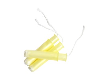 Photo of Applicator tampons on white background, top view. Menstrual hygiene product