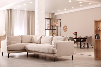 Photo of Modern living room interior with comfortable sofa and wooden table