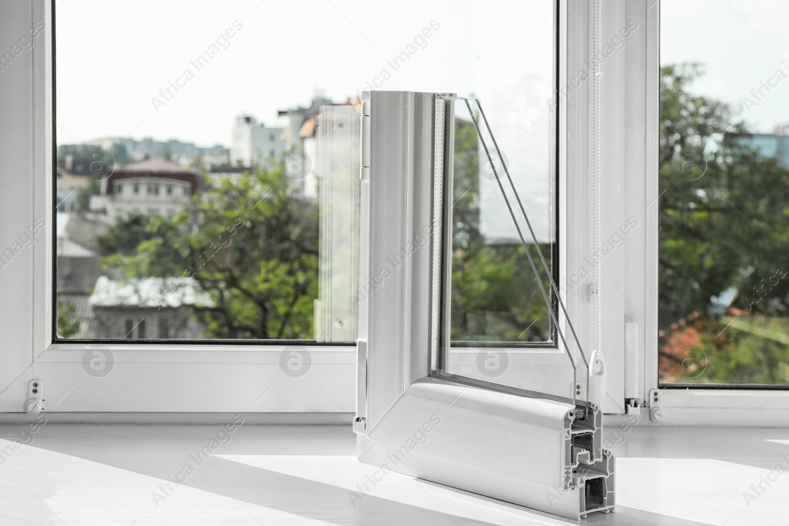 Photo of Sample of modern window profile on sill. Space for text