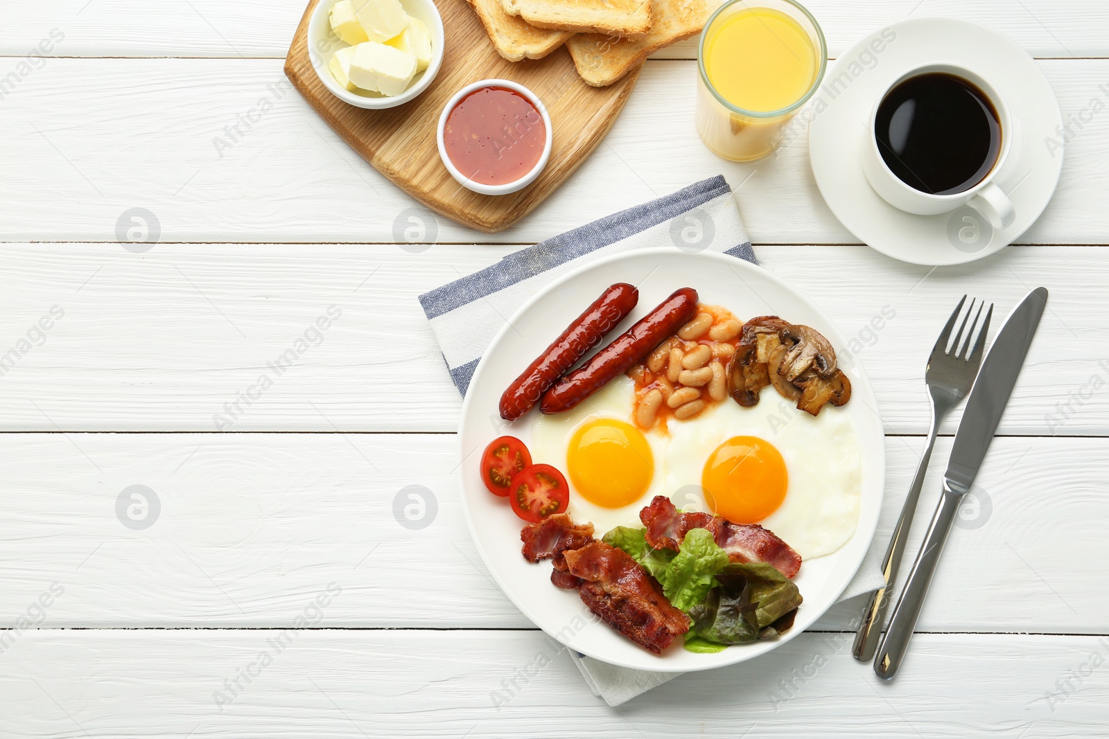 Photo of Delicious breakfast with sunny side up eggs served on white wooden table, flat lay. Space for text