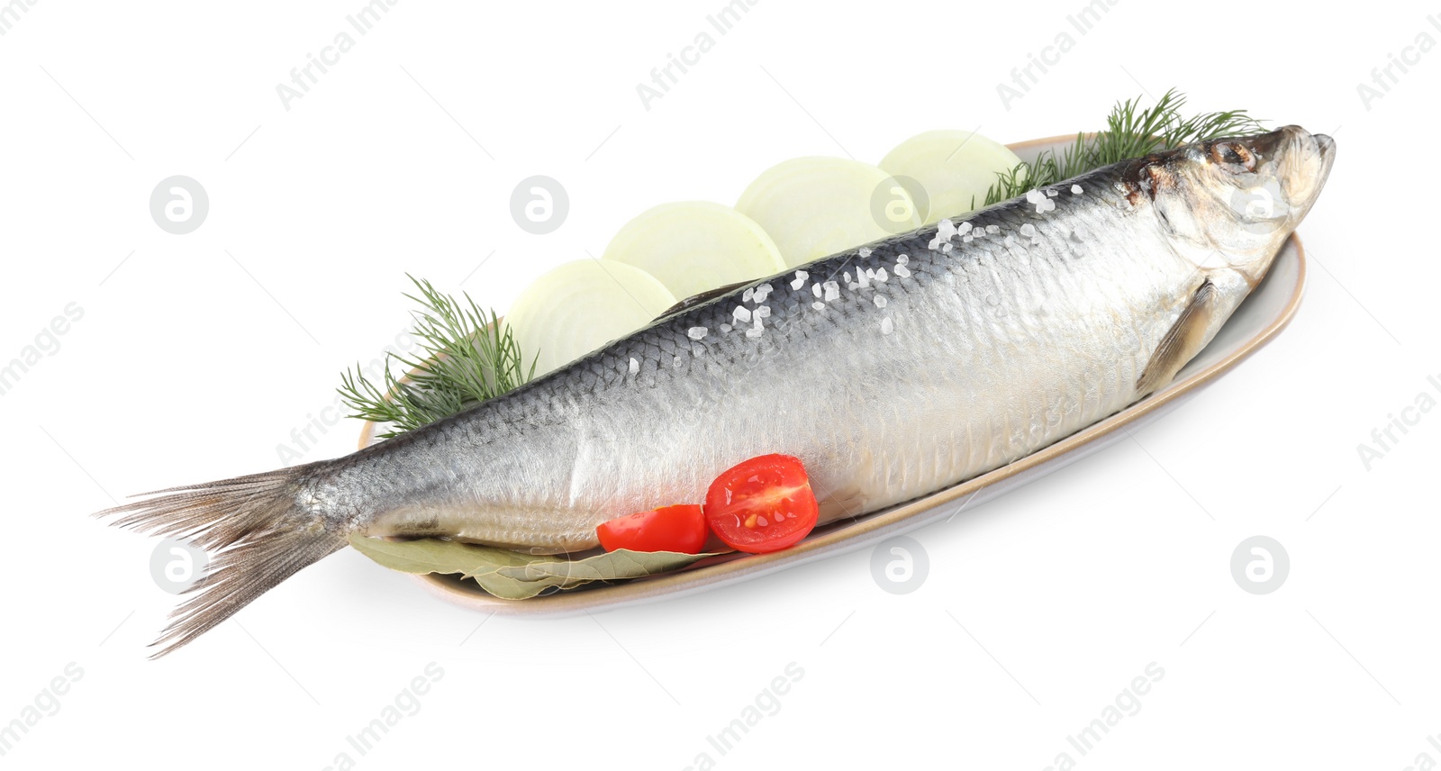 Photo of Plate with salted herring, onion rings, cherry tomato, bay leaves and dill isolated on white