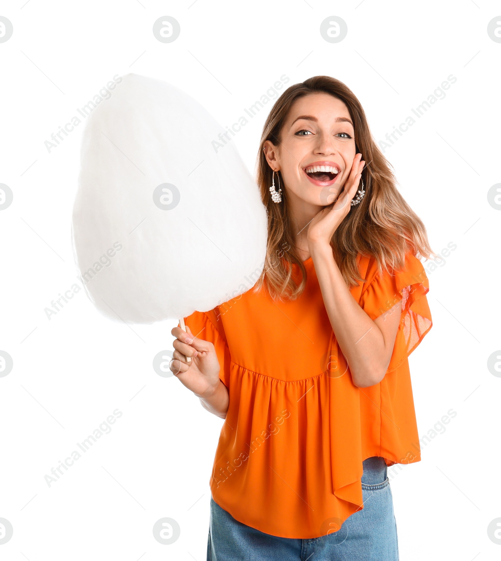 Photo of Emotional young woman with cotton candy on white background