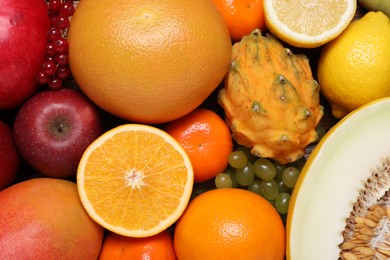 Photo of Many different fresh fruits and berries as background, top view