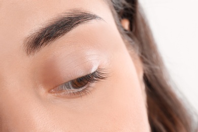 Young woman with beautiful natural eyelashes, closeup view