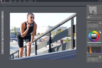 Image of Professional photo editor application.  young woman in sportswear with headphones