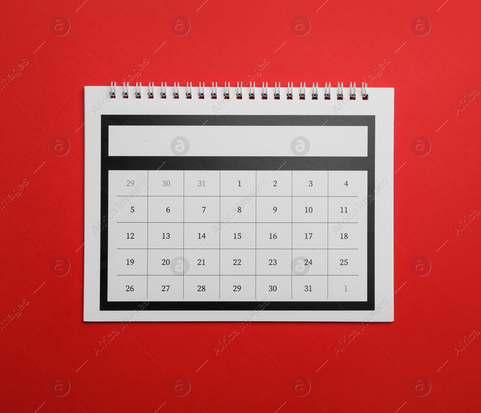 Photo of Paper calendar on red background, top view