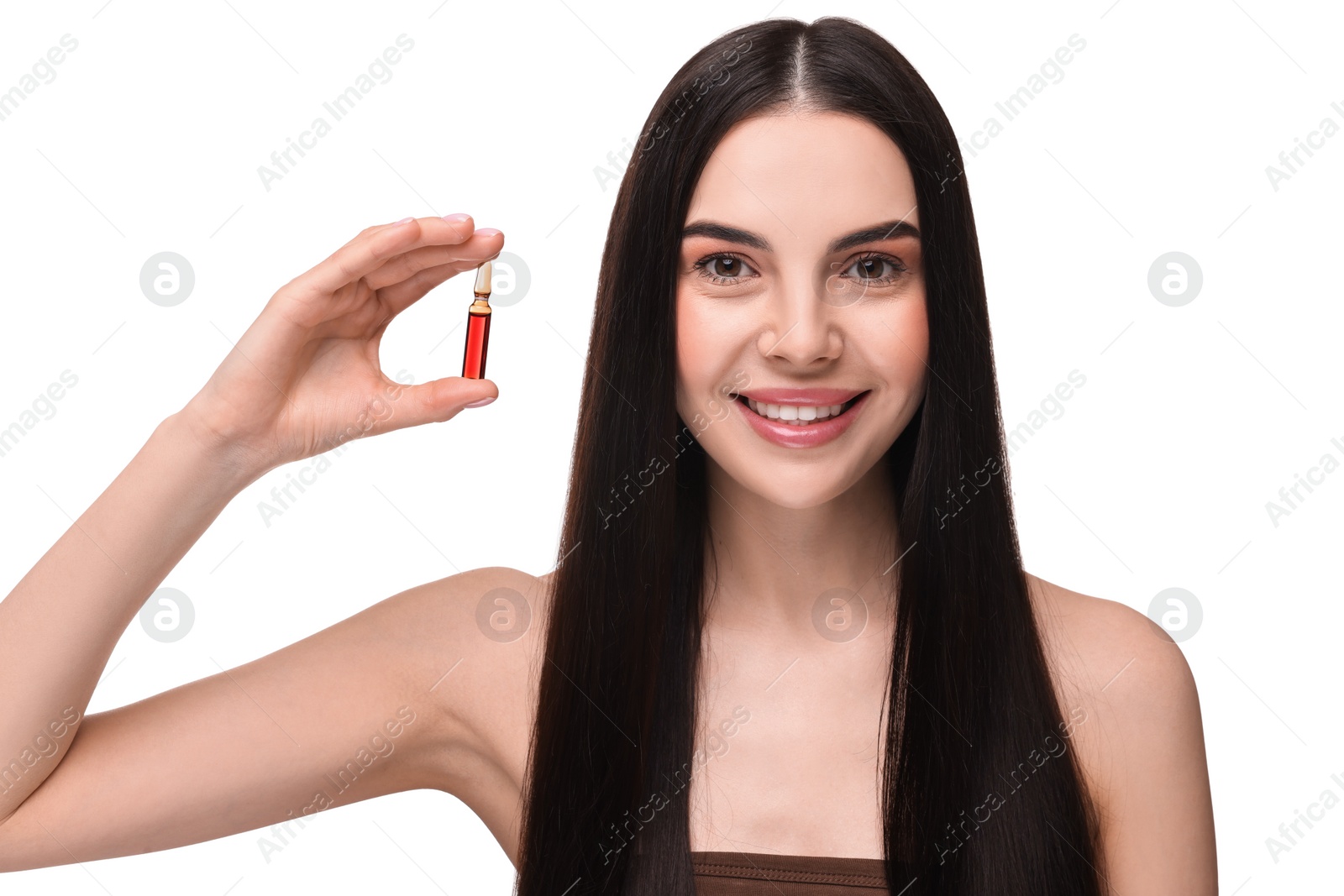 Photo of Beautiful young woman holding skincare ampoule on white background