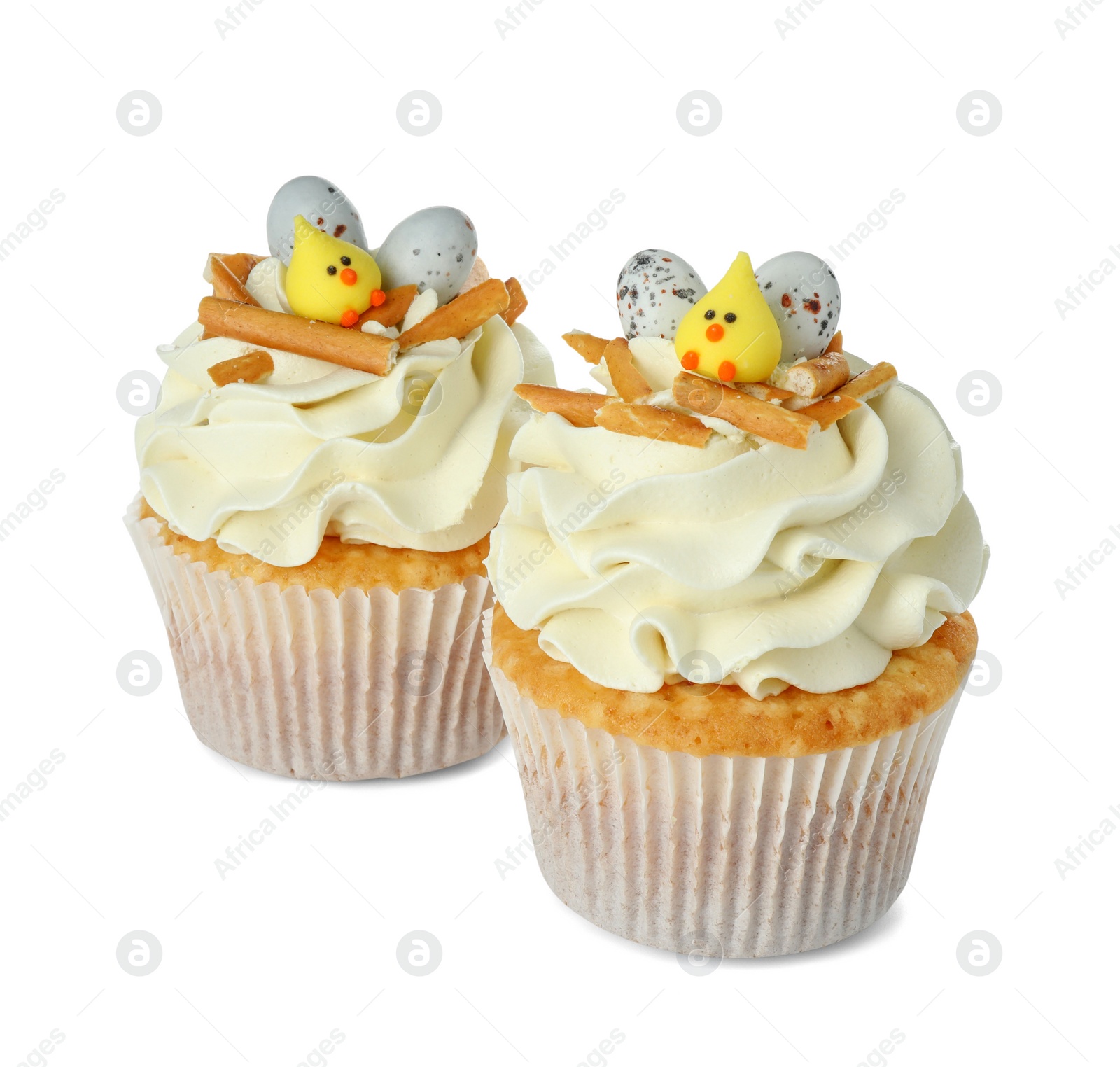 Photo of Tasty Easter cupcakes with vanilla cream isolated on white