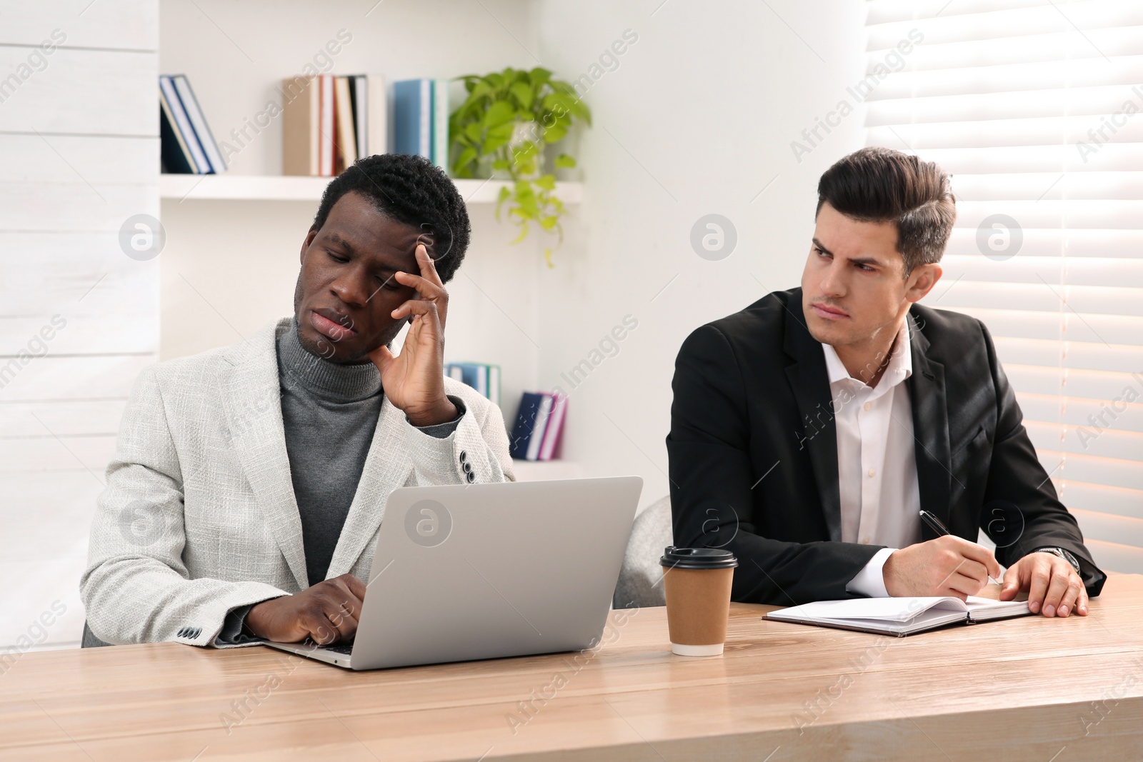 Photo of African American man suffering from racial discrimination at work