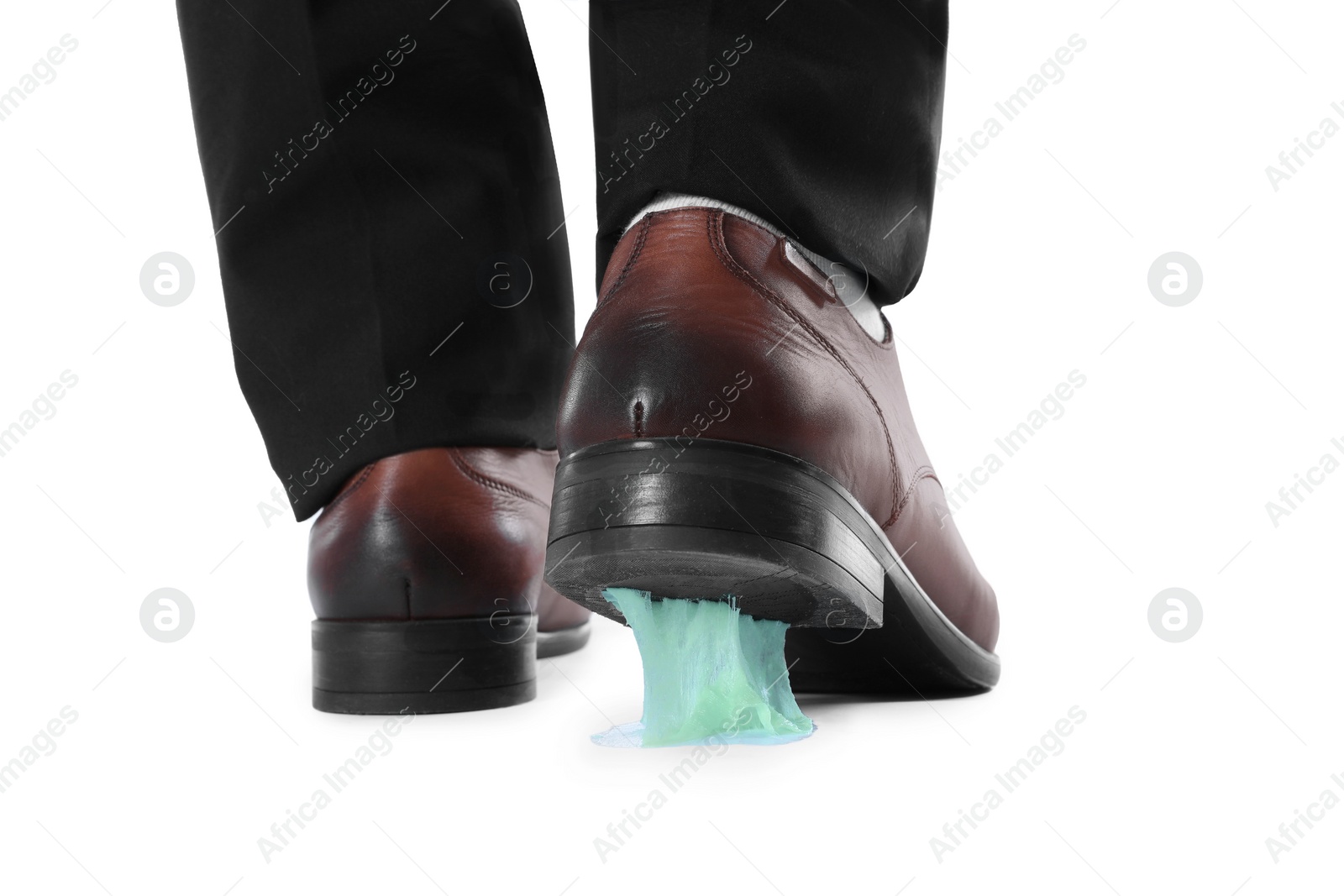 Photo of Man stepping into chewing gum on white background, closeup