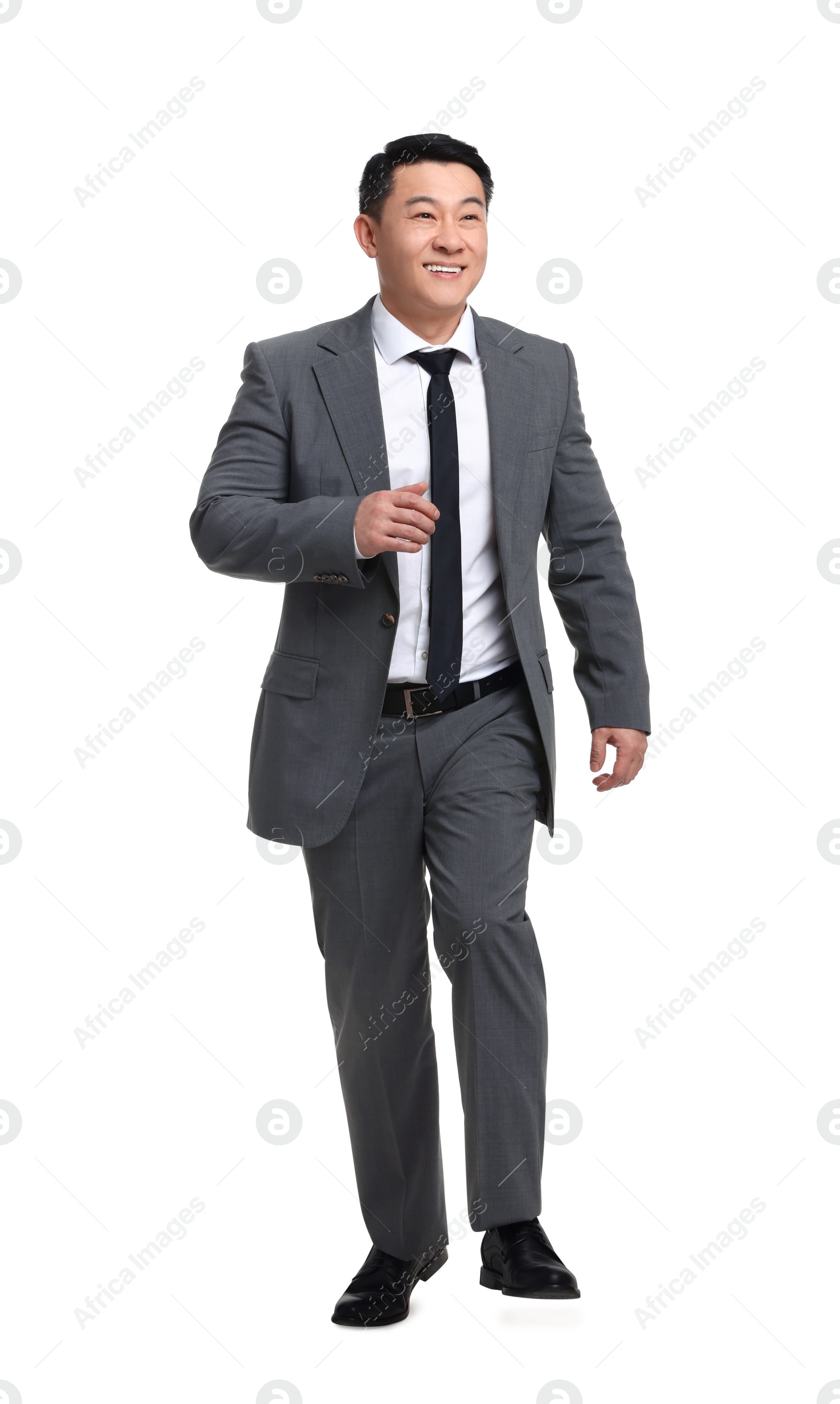 Photo of Businessman in suit walking on white background