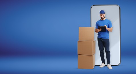 Image of Courier with stack of parcels and clipboard near huge smartphone on blue background. Delivery service. Banner design with space for text