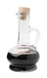 Photo of Organic balsamic vinegar in glass jug isolated on white