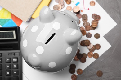 Photo of Flat lay composition with piggy bank on grey table. Money savings