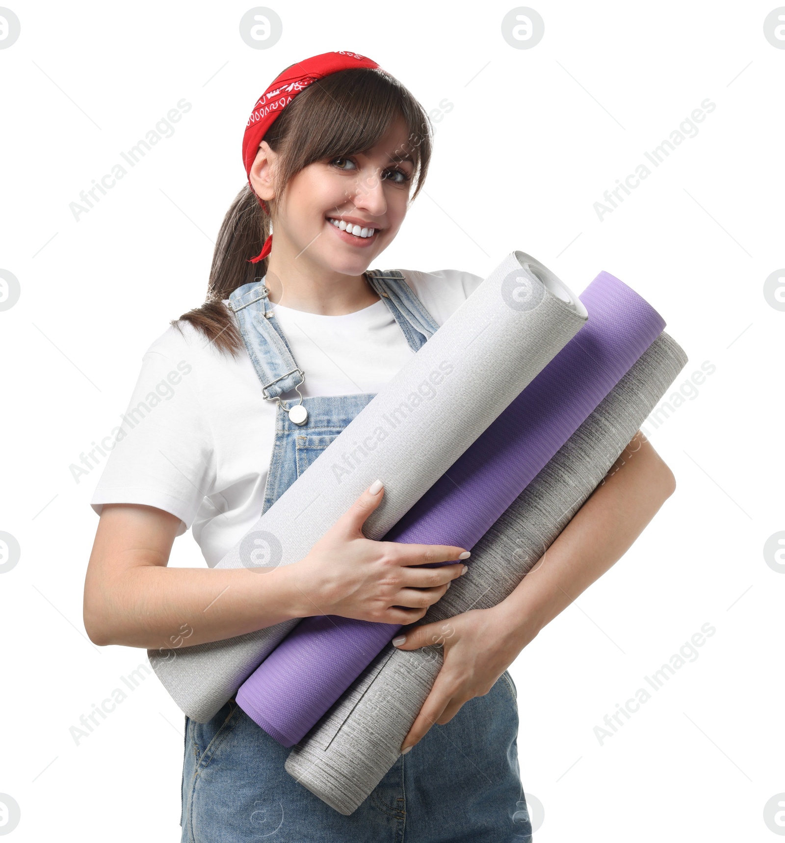 Photo of Beautiful woman with wallpaper rolls on white background