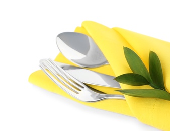 Photo of Folded napkin with fork, spoon and knife on white background, closeup