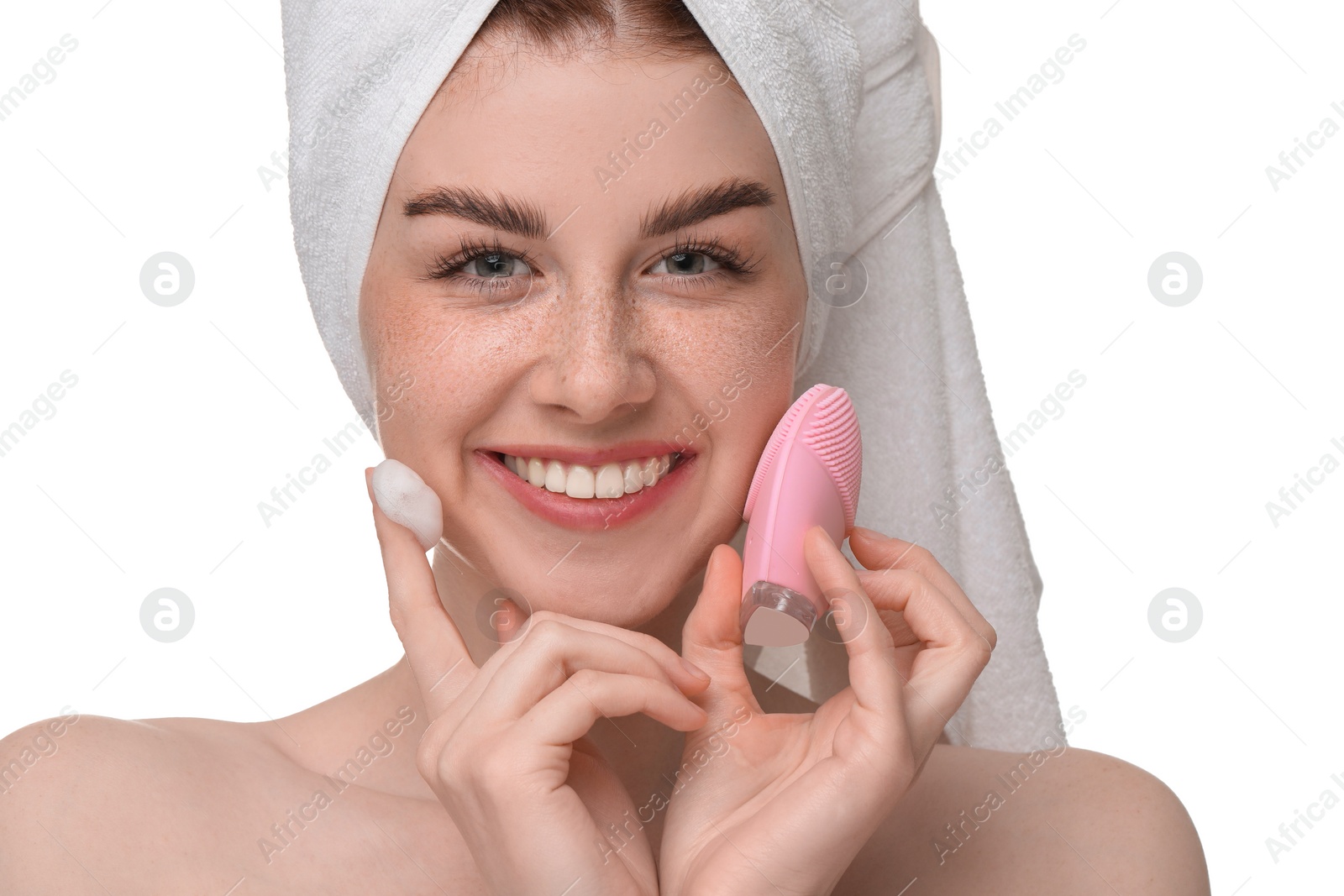 Photo of Washing face. Young woman with brush and cleansing foam on white background, closeup