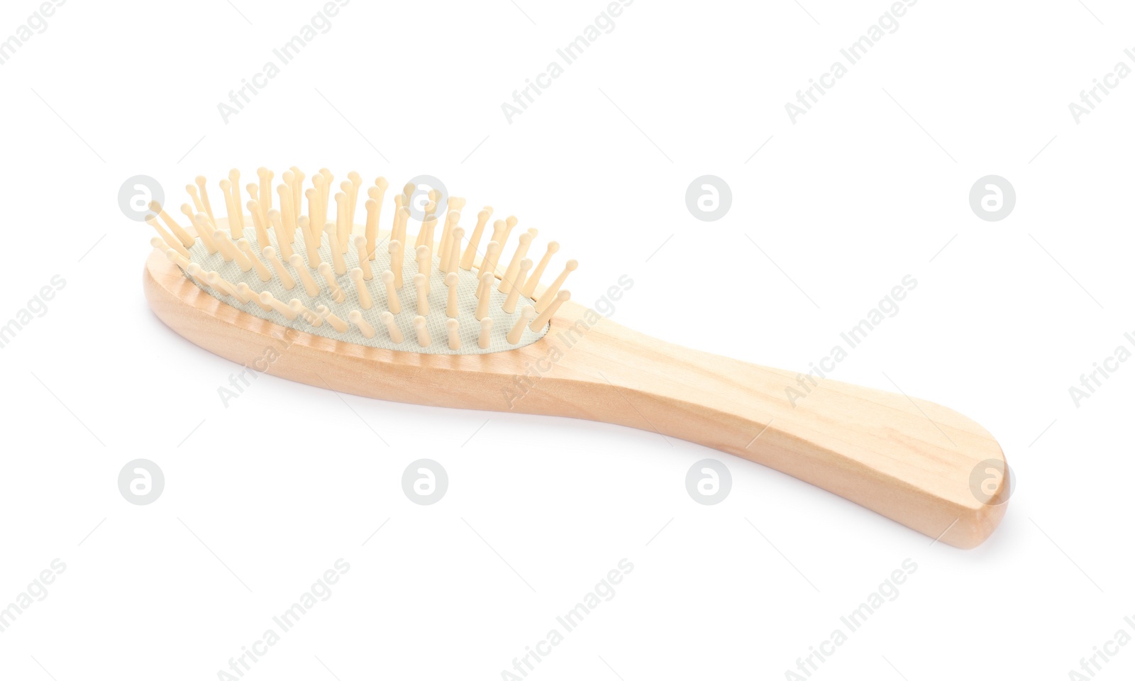 Photo of New wooden hair brush isolated on white