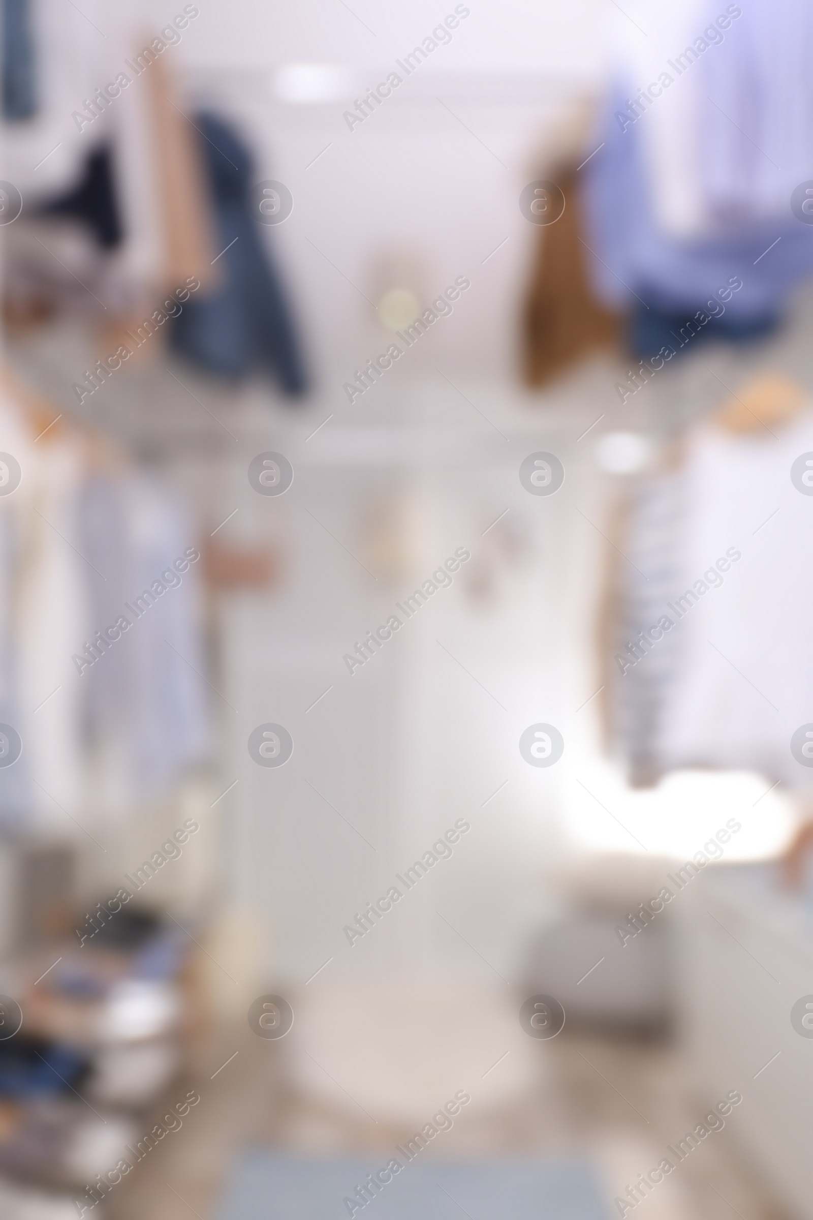 Photo of Blurred view of modern dressing room with stylish clothes