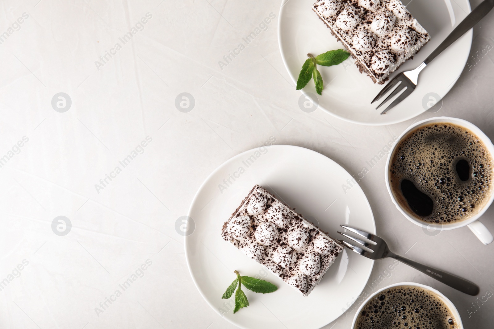 Photo of Flat lay composition with tiramisu cakes on table, space for text