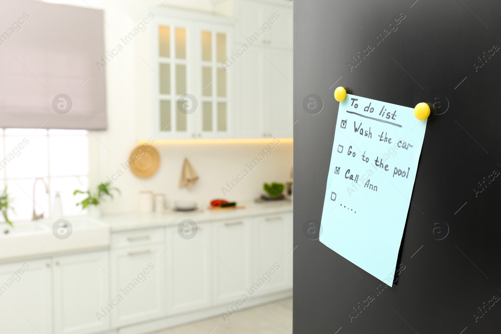 Photo of To do list on fridge in kitchen. Space for text