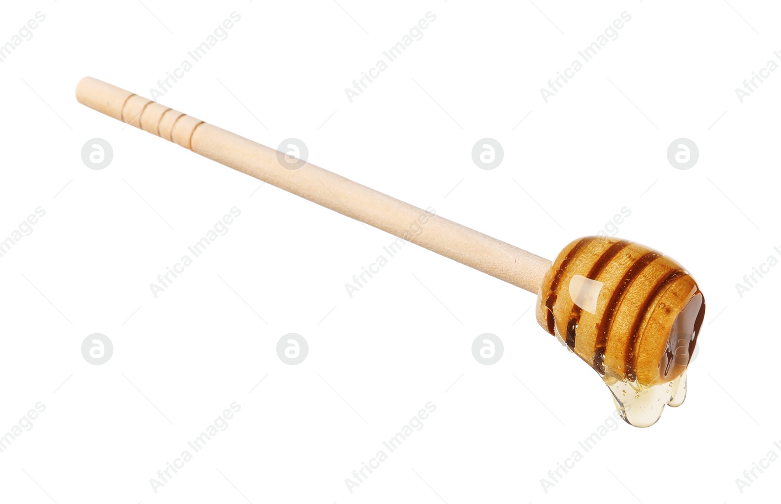 Photo of Natural honey dripping from dipper on white background