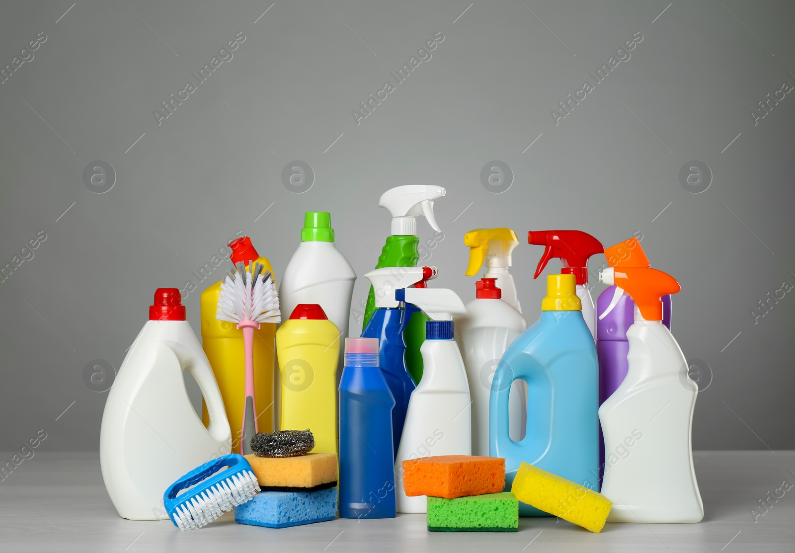 Photo of Different cleaning products and supplies on light table