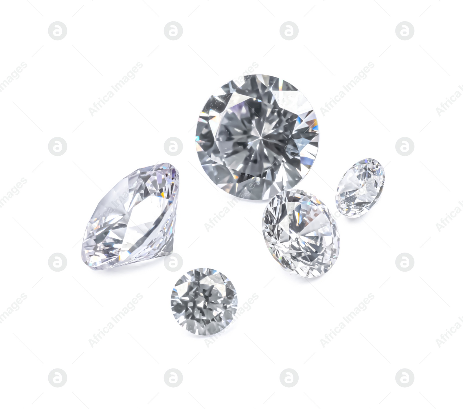 Photo of Different beautiful shiny diamonds isolated on white